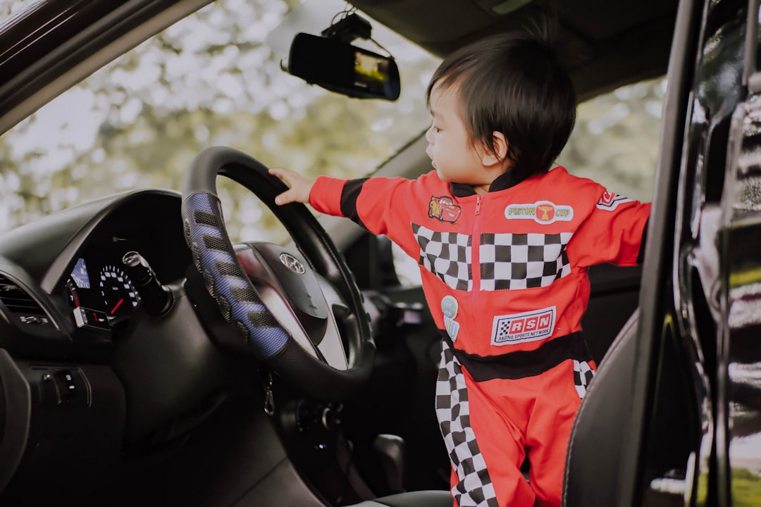 Driver adjusting car mirrors before driving — cockpit drill